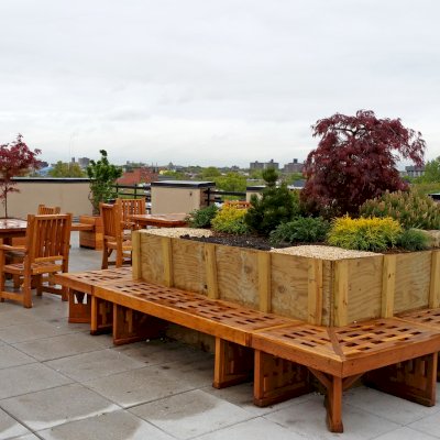 Square Patio Tables (Options: 4', 4 Chairs, Redwood, Ruth Style Chairs, 2 Armchairs + Side Chairs, No Cushions, Standard Tabletop Option, Squared corners, No Umbrella Hole, Transparent Premium Sealant). Photo Also Shows a Custom Square Lighthouse Bench and Some Mendocino Planters. Photo Courtesy of A. Guttman of Brooklyn, NY.