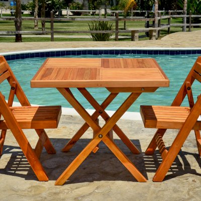 Square Wooden Folding Table (Options: 2 Folding Chairs, Douglas-fir, No Cushions, Standard Tabletop, Checkerboard Design, Rounded Corners, No Umbrella Hole, Transparent Premium Sealant). Photo Courtesy of El Laurel, Ensenada, Mexico.