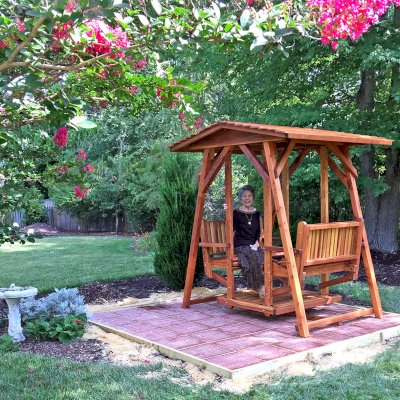 St. Anthony's Face to Face Gliders (Adult Size, Redwood, No Beverage Armrests, No Kid's Platform, Standard Closed Roof, No Engraving, Transparent Premium Sealant). Photo Courtesy of Dulce B. of Yorktown, VA.