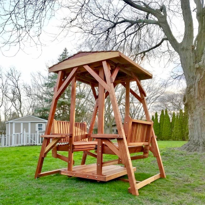 St. Anthony's Face to Face Gliders (Adult Size, Redwood, With Beverage Armrests, No Kid's Platform, Standard Closed Roof, No Engraving, Transparent Premium Sealant). Photo Courtesy of N. Prokuski of Burr Ridge, Illinois. St. Anthony's Face to Face Gliders (Adult Size, Redwood, With Beverage Armrests, No Kid's Platform, Standard Closed Roof, No Engraving, Transparent Premium Sealant). Photo Courtesy of N. Prokuski of Burr Ridge, Illinois.
