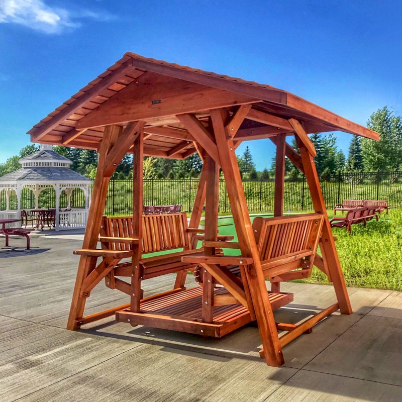 St. Anthony's Face to Face Gliders (XW, Redwood, No Kid's Platform, XW Roof, No Engraving, Transparent Premium Sealant). Photo Courtesy of Wealshire of Medina, MN. St. Anthony's Face to Face Gliders (XW, Redwood, No Kid's Platform, XW Roof, No Engraving, Transparent Premium Sealant). Photo Courtesy of Wealshire of Medina, MN.