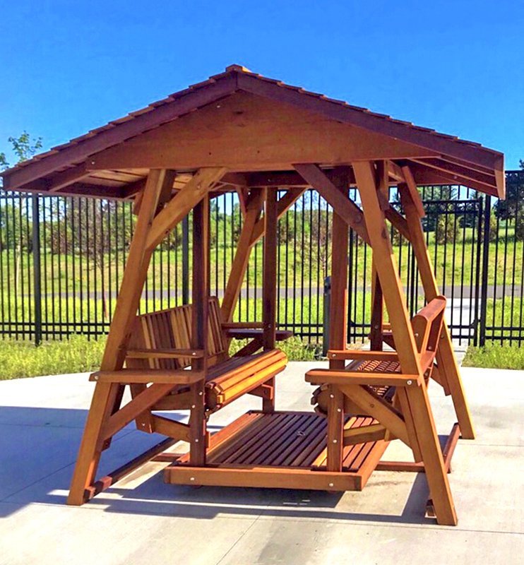 St. Anthony's Face to Face Gliders (XW, Redwood, No Kid's Platform, XW Roof, No Engraving, Transparent Premium Sealant). Photo Courtesy of Wealshire of Medina, MN. St. Anthony's Face to Face Gliders (XW, Redwood, No Kid's Platform, XW Roof, No Engraving, Transparent Premium Sealant). Photo Courtesy of Wealshire of Medina, MN.