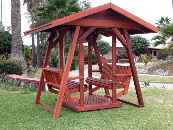 St. Anthony's Face to Face Gliders (XW, Old-Growth Redwood, No Kid's Platform, XW Roof, No Engraving, Transparent Premium Sealant). St. Anthony's Face to Face Gliders (XW, Old-Growth Redwood, No Kid's Platform, XW Roof, No Engraving, Transparent Premium Sealant).
