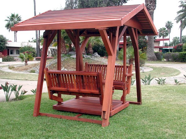 St. Anthony's Face to Face Gliders (XW, Old-Growth Redwood, No Kid's Platform, XW Roof, No Engraving, Transparent Premium Sealant). St. Anthony's Face to Face Gliders (XW, Old-Growth Redwood, No Kid's Platform, XW Roof, No Engraving, Transparent Premium Sealant).