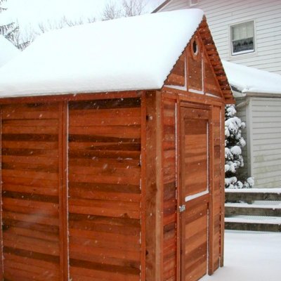 Storage Mini Barns (Options: 6' W, 6' D, 7' H, Redwood, Single Door, Transparent Premium Sealant).  Yes, the roof and overall structure is plenty strong to take the weather head on...