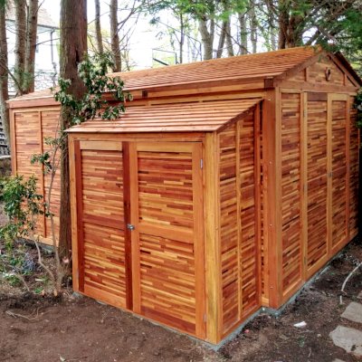 Storage Sheds (Options: 7' W, 3' D, 7' H, Mosaic Redwood, Double Doors, Three Shelves at 28" H & 14" H, Transparent Premium Sealant). Photo Also Shows a Storage Mini Barn. Photo Courtesy of J. VanderKamp of Westport, Connecticut.