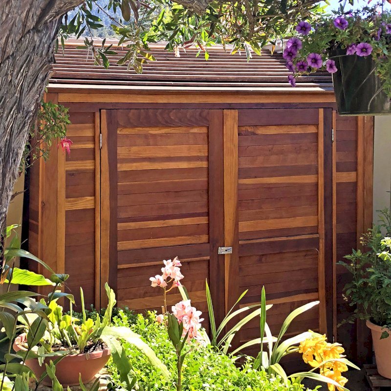 Storage Shed (Options: 7' W, 4.5' D, 7' H, Redwood, Double Doors, No Shelving, With Deck, Transparent Premium Sealant). Photo Courtesy of I. Speiser of Carmel, CA Storage Shed (Options: 7' W, 4.5' D, 7' H, Redwood, Double Doors, No Shelving, With Deck, Transparent Premium Sealant). Photo Courtesy of I. Speiser of Carmel, CA