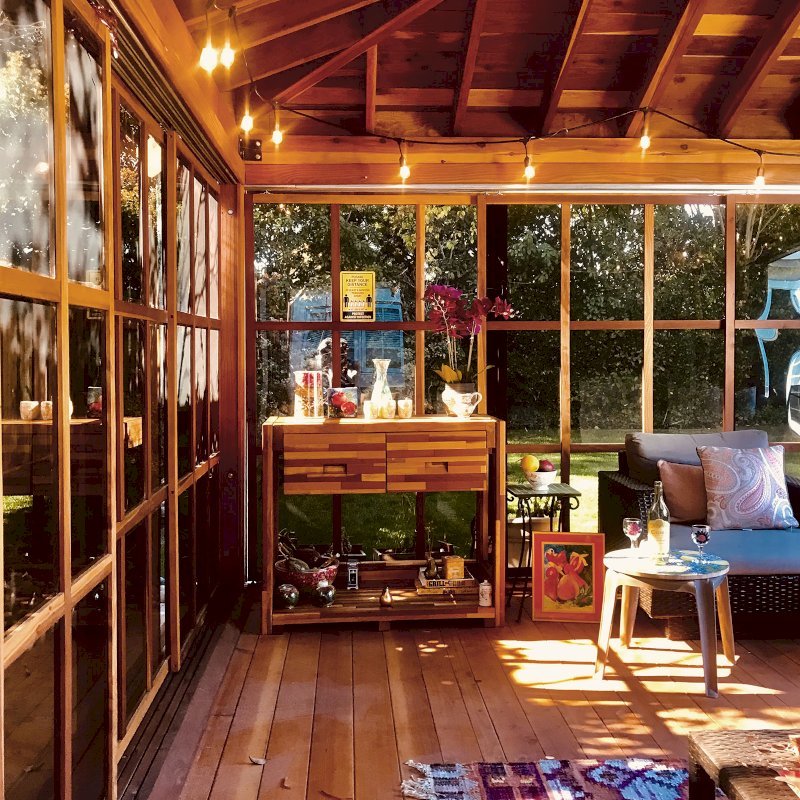 Sun Gazebo with Sliding Doors (Options: Custom Size 16' L x 14' W, California Redwood, 8 ft Wall Height, Without Skylight, Complete Floor, with Metal Roof, Transparent Premium Sealant). Photo Also Shows an Eli's Potting Bench. Photo Courtesy of R. Graham-Helwig of Foster City, California. Sun Gazebo with Sliding Doors (Options: Custom Size 16' L x 14' W, California Redwood, 8 ft Wall Height, Without Skylight, Complete Floor, with Metal Roof, Transparent Premium Sealant). Photo Also Shows an Eli's Potting Bench. Photo Courtesy of R. Graham-Helwig of Foster City, California.