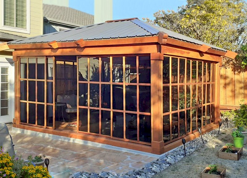 Sun Gazebo with Sliding Doors (Options: Custom Size 16' L x 14' W, California Redwood, 8 ft Wall Height, Without Skylight, Complete Floor, with Metal Roof, Transparent Premium Sealant). Photo Courtesy of R. Graham-Helwig of Foster City, California. Sun Gazebo with Sliding Doors (Options: Custom Size 16' L x 14' W, California Redwood, 8 ft Wall Height, Without Skylight, Complete Floor, with Metal Roof, Transparent Premium Sealant). Photo Courtesy of R. Graham-Helwig of Foster City, California.