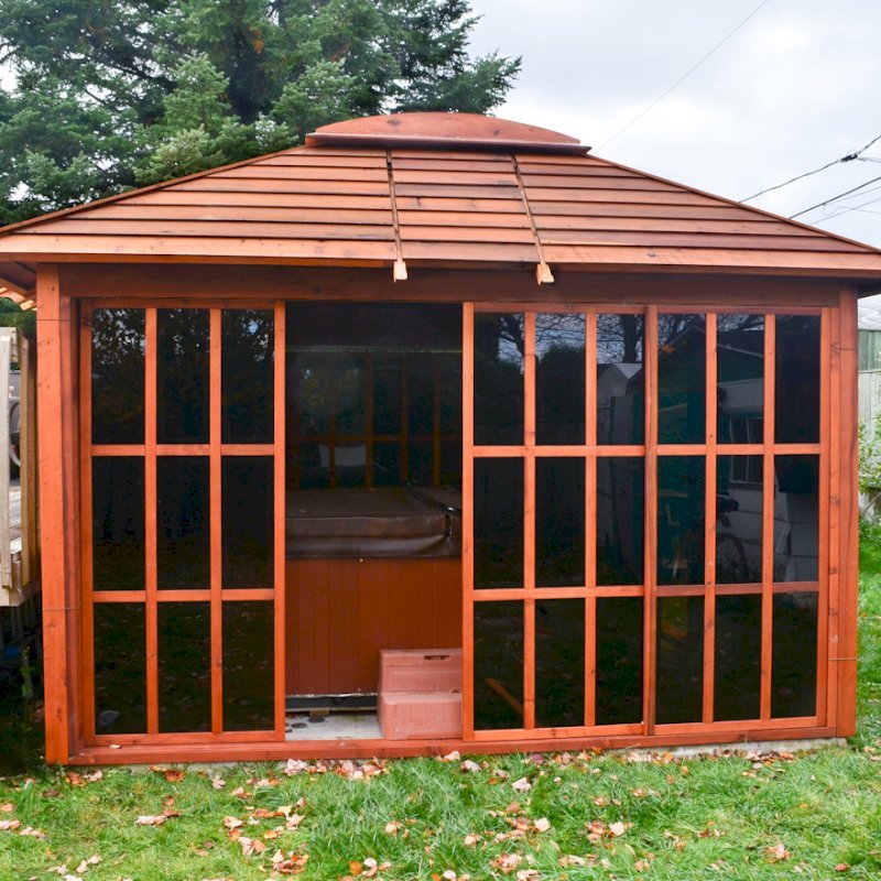 Sun Gazebo with Sliding Doors (Options: 12' L, 12' W, Mature Redwood, 4' x 8' Skylight, No Flooring, Transparent Premium Sealant). Photo Courtesy of Stephane Jean of Chicoutimi, Quebec. Sun Gazebo with Sliding Doors (Options: 12' L, 12' W, Mature Redwood, 4' x 8' Skylight, No Flooring, Transparent Premium Sealant). Photo Courtesy of Stephane Jean of Chicoutimi, Quebec.