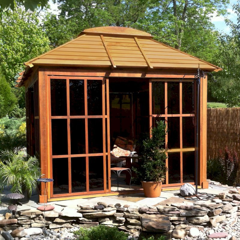 Sun Gazebo with Sliding Doors (Options: 12' L, 10' W, Mature Redwood, 4' x 8' Skylight, No Flooring, Transparent Premium Sealant). Cement Anchors on 4 x 4 posts by Custom Request. Photo Courtesy of Clay Rutledge of Audubon, Pennsylvania. Sun Gazebo with Sliding Doors (Options: 12' L, 10' W, Mature Redwood, 4' x 8' Skylight, No Flooring, Transparent Premium Sealant). Cement Anchors on 4 x 4 posts by Custom Request. Photo Courtesy of Clay Rutledge of Audubon, Pennsylvania.