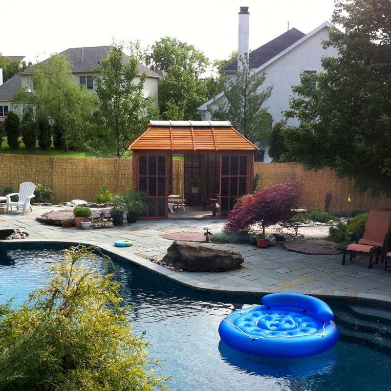 Sun Gazebo with Sliding Doors (Options: 12' L, 10' W, Mature Redwood, 4' x 8' Skylight, No Flooring, Transparent Premium Sealant). Cement Anchors on 4 x 4 posts by Custom Request. Photo Courtesy of Clay Rutledge of Audubon, Pennsylvania. Sun Gazebo with Sliding Doors (Options: 12' L, 10' W, Mature Redwood, 4' x 8' Skylight, No Flooring, Transparent Premium Sealant). Cement Anchors on 4 x 4 posts by Custom Request. Photo Courtesy of Clay Rutledge of Audubon, Pennsylvania.