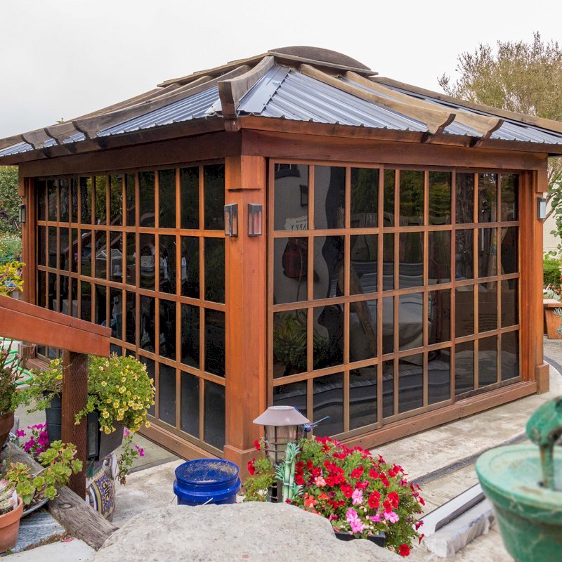Sun Gazebo with Sliding Doors (Options: 14' L, 12' W, California Redwood, 4' x 6' Skylight, Complete Floor, Transparent Premium Sealant). Metal roof added by custom request. The roof timbers were not resealed and are 4 years old while the rest of the structure was resealed recently. Photo Courtesy of A. Ramon of South San Francisco, CA. Note: Metal Roof provided by Home Depot: 12ft. Classic Rib Steel Roof Panel in Charcoal, Model #2313417, Internet #204255071 Sun Gazebo with Sliding Doors (Options: 14' L, 12' W, California Redwood, 4' x 6' Skylight, Complete Floor, Transparent Premium Sealant). Metal roof added by custom request. The roof timbers were not resealed and are 4 years old while the rest of the structure was resealed recently. Photo Courtesy of A. Ramon of South San Francisco, CA. Note: Metal Roof provided by Home Depot: 12ft. Classic Rib Steel Roof Panel in Charcoal, Model #2313417, Internet #204255071