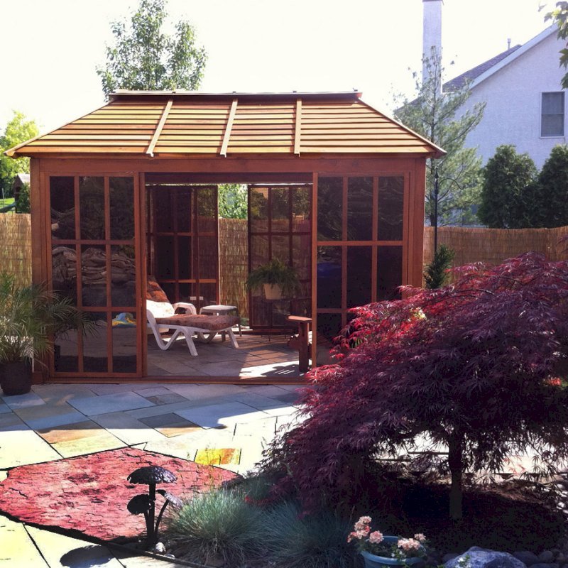 Sun Gazebo with Sliding Doors (Options: 12' L, 10' W, Mature Redwood, 4' x 8' Skylight, No Flooring, Transparent Premium Sealant). Cement Anchors on 4 x 4 posts by Custom Request. Photo Courtesy of Clay Rutledge of Audubon, Pennsylvania. Sun Gazebo with Sliding Doors (Options: 12' L, 10' W, Mature Redwood, 4' x 8' Skylight, No Flooring, Transparent Premium Sealant). Cement Anchors on 4 x 4 posts by Custom Request. Photo Courtesy of Clay Rutledge of Audubon, Pennsylvania.