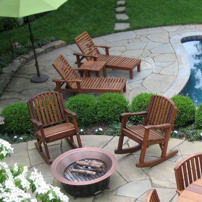 Terrace Wood Outdoor Coffee Table between Loungers in background (Options: 21 1/2" Size, Mature Redwood, 18" H, Transparent Premium Sealant). Photo Courtesy of Susan Salmon of Collingswood, NJ.