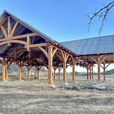 Custom Cardinal's Nest Pavilion (Options: 74' x 74', Douglas-fir, 20-Post Anchor Kit for High-Wind, 10' H Posts, Horizontal Decorative Trims for All Posts, with 5 Ceiling Fan Bases, Transparent Premium Sealant, White Wash for Ceiling). Photo Courtesy of J. Fookes of Elk Creek, CA.