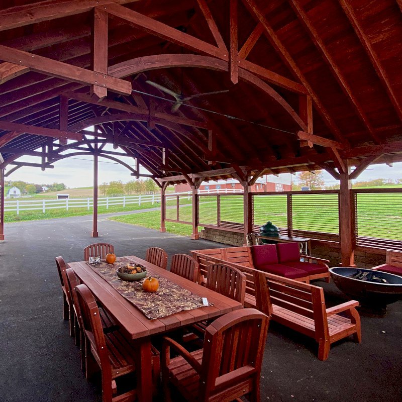 The Cardinal's Nest Pavilions (Options: 45’ L x 32’ W, Douglas-fir, 12-Post Anchor Kit for Gale-Wind, Electrical Wiring Trim Kit for 1 Post, 1 Ceiling Fan Base, Cherry Stain Premium Sealant, with 6 Custom Half Height Louvered Privacy Wall Panels) with a San Francisco Patio Table Set and Custom Kari's Chairs. Photo Courtesy of S. Steckman of East Liverpool, Ohio. The Cardinal's Nest Pavilions (Options: 45’ L x 32’ W, Douglas-fir, 12-Post Anchor Kit for Gale-Wind, Electrical Wiring Trim Kit for 1 Post, 1 Ceiling Fan Base, Cherry Stain Premium Sealant, with 6 Custom Half Height Louvered Privacy Wall Panels) with a San Francisco Patio Table Set and Custom Kari's Chairs. Photo Courtesy of S. Steckman of East Liverpool, Ohio.