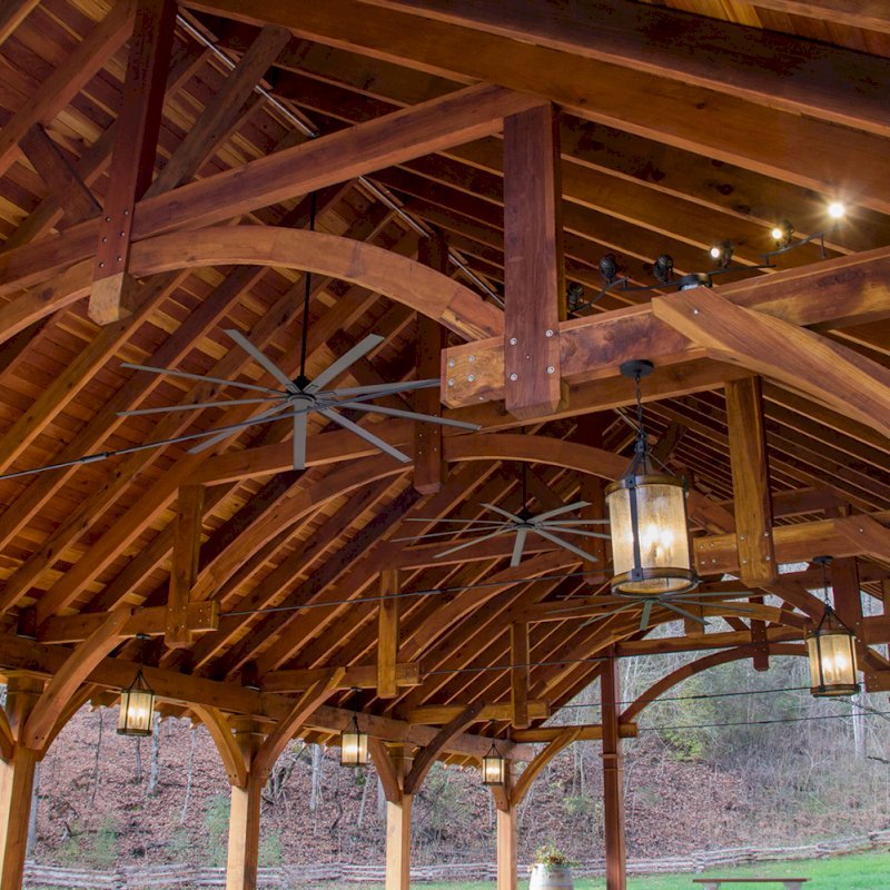 The Cardinal's Nest Pavilions (Options: 60’ L x 34’ W, California Redwood, 16-Post Anchor Kit for Hurricane Anchors will be at least 24" x 24" x 36", Electrical Wiring Trim Kit for 6 Posts, and 6 Cutouts for Outlets, 2 Ceiling Fan Bases and at least 4 cutouts for Electrical Boxes, Transparent Premium Sealant), Photo Courtesy of S. Hilton of Sevierville, TN. The Cardinal's Nest Pavilions (Options: 60’ L x 34’ W, California Redwood, 16-Post Anchor Kit for Hurricane Anchors will be at least 24" x 24" x 36", Electrical Wiring Trim Kit for 6 Posts, and 6 Cutouts for Outlets, 2 Ceiling Fan Bases and at least 4 cutouts for Electrical Boxes, Transparent Premium Sealant), Photo Courtesy of S. Hilton of Sevierville, TN.