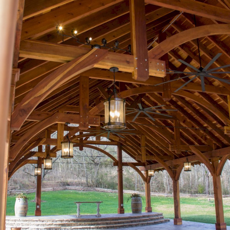 The Cardinal's Nest Pavilions (Options: 60’ L x 34’ W, California Redwood, 16-Post Anchor Kit for Hurricane Anchors will be at least 24" x 24" x 36", Electrical Wiring Trim Kit for 6 Posts, and 6 Cutouts for Outlets, 2 Ceiling Fan Bases and at least 4 cutouts for Electrical Boxes, Transparent Premium Sealant), Photo Courtesy of S. Hilton of Sevierville, TN. The Cardinal's Nest Pavilions (Options: 60’ L x 34’ W, California Redwood, 16-Post Anchor Kit for Hurricane Anchors will be at least 24" x 24" x 36", Electrical Wiring Trim Kit for 6 Posts, and 6 Cutouts for Outlets, 2 Ceiling Fan Bases and at least 4 cutouts for Electrical Boxes, Transparent Premium Sealant), Photo Courtesy of S. Hilton of Sevierville, TN.