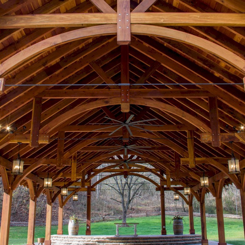 The Cardinal's Nest Pavilions (Options: 60’ L x 34’ W, California Redwood, 16-Post Anchor Kit for Hurricane Anchors will be at least 24" x 24" x 36", Electrical Wiring Trim Kit for 6 Posts, and 6 Cutouts for Outlets, 2 Ceiling Fan Bases and at least 4 cutouts for Electrical Boxes, Transparent Premium Sealant), Photo Courtesy of S. Hilton of Sevierville, TN. The Cardinal's Nest Pavilions (Options: 60’ L x 34’ W, California Redwood, 16-Post Anchor Kit for Hurricane Anchors will be at least 24" x 24" x 36", Electrical Wiring Trim Kit for 6 Posts, and 6 Cutouts for Outlets, 2 Ceiling Fan Bases and at least 4 cutouts for Electrical Boxes, Transparent Premium Sealant), Photo Courtesy of S. Hilton of Sevierville, TN.