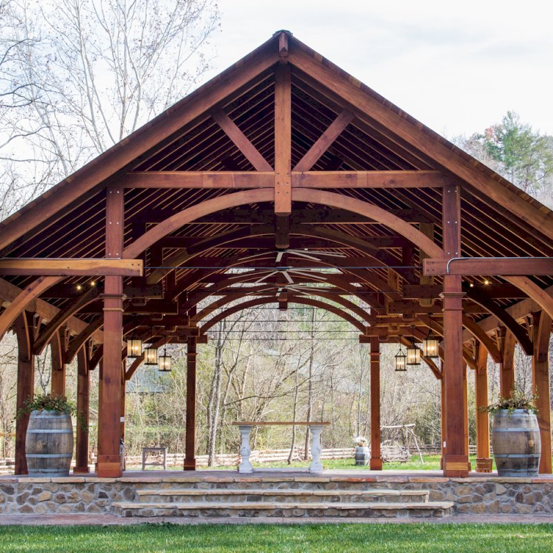 The Cardinals Nest Pavilions (Options: 60’ L x 34’ W, California Redwood, 16-Post Anchor Kit for Hurricane Anchors will be at least 24" x 24" x 36", Electrical Wiring Trim Kit for 6 Posts, and 6 Cutouts for Outlets, 2 Ceiling Fan Bases and at least 4 cutouts for Electrical Boxes, Transparent Premium Sealant), Photo Courtesy of S. Hilton of Sevierville, TN. The Cardinals Nest Pavilions (Options: 60’ L x 34’ W, California Redwood, 16-Post Anchor Kit for Hurricane Anchors will be at least 24" x 24" x 36", Electrical Wiring Trim Kit for 6 Posts, and 6 Cutouts for Outlets, 2 Ceiling Fan Bases and at least 4 cutouts for Electrical Boxes, Transparent Premium Sealant), Photo Courtesy of S. Hilton of Sevierville, TN.