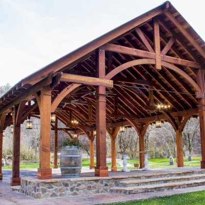 The Cardinal's Nest Pavilions (Options: 60’ L x 34’ W, California Redwood, 16-Post Anchor Kit for High Wind, Electrical Wiring Trim Kit for 6 Posts, and 6 Cutouts for Outlets, 2 Ceiling Fan Bases and at least 4 cutouts for Electrical Boxes, Transparent Premium Sealant), Photo Courtesy of S. Hilton of Sevierville, TN.