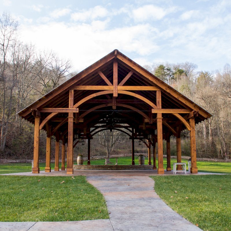 The Cardinals Nest Pavilions (Options: 60’ L x 34’ W, California Redwood, 16-Post Anchor Kit for Hurricane Anchors will be at least 24" x 24" x 36", Electrical Wiring Trim Kit for 6 Posts, and 6 Cutouts for Outlets, 2 Ceiling Fan Bases and at least 4 cutouts for Electrical Boxes, Transparent Premium Sealant), Photo Courtesy of S. Hilton of Sevierville, TN. The Cardinals Nest Pavilions (Options: 60’ L x 34’ W, California Redwood, 16-Post Anchor Kit for Hurricane Anchors will be at least 24" x 24" x 36", Electrical Wiring Trim Kit for 6 Posts, and 6 Cutouts for Outlets, 2 Ceiling Fan Bases and at least 4 cutouts for Electrical Boxes, Transparent Premium Sealant), Photo Courtesy of S. Hilton of Sevierville, TN.
