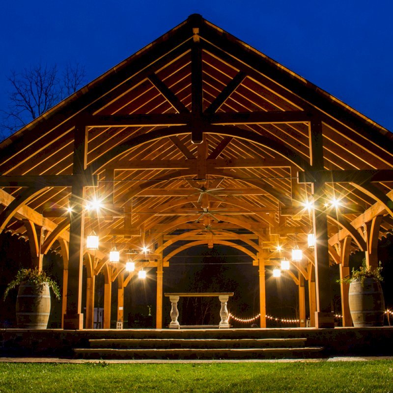 The Cardinals Nest Pavilions (Options: 60’ L x 34’ W, California Redwood, 16-Post Anchor Kit for Hurricane Anchors will be at least 24" x 24" x 36", Electrical Wiring Trim Kit for 6 Posts, and 6 Cutouts for Outlets, 2 Ceiling Fan Bases and at least 4 cutouts for Electrical Boxes, Transparent Premium Sealant), Photo Courtesy of S. Hilton of Sevierville, TN. The Cardinals Nest Pavilions (Options: 60’ L x 34’ W, California Redwood, 16-Post Anchor Kit for Hurricane Anchors will be at least 24" x 24" x 36", Electrical Wiring Trim Kit for 6 Posts, and 6 Cutouts for Outlets, 2 Ceiling Fan Bases and at least 4 cutouts for Electrical Boxes, Transparent Premium Sealant), Photo Courtesy of S. Hilton of Sevierville, TN.