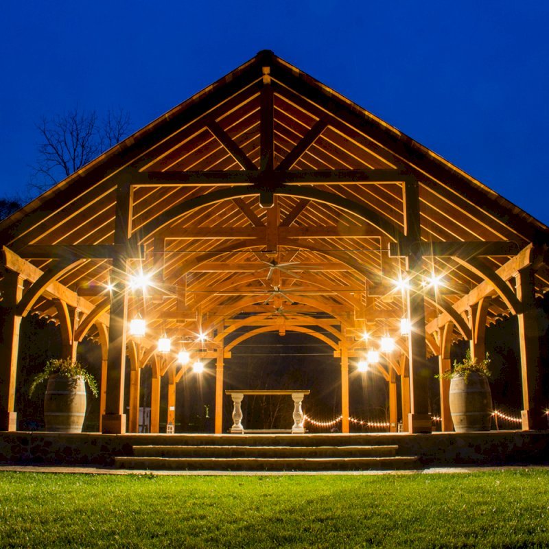The Cardinal's Nest Pavilions (Options: 60’ L x 34’ W, California Redwood, 16-Post Anchor Kit for Hurricane Anchors will be at least 24" x 24" x 36", Electrical Wiring Trim Kit for 6 Posts, and 6 Cutouts for Outlets, 2 Ceiling Fan Bases and at least 4 cutouts for Electrical Boxes, Transparent Premium Sealant), Photo Courtesy of S. Hilton of Sevierville, TN. The Cardinal's Nest Pavilions (Options: 60’ L x 34’ W, California Redwood, 16-Post Anchor Kit for Hurricane Anchors will be at least 24" x 24" x 36", Electrical Wiring Trim Kit for 6 Posts, and 6 Cutouts for Outlets, 2 Ceiling Fan Bases and at least 4 cutouts for Electrical Boxes, Transparent Premium Sealant), Photo Courtesy of S. Hilton of Sevierville, TN.