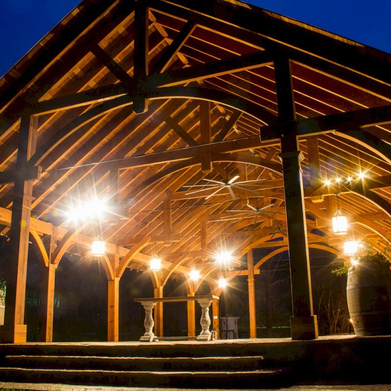 The Cardinal's Nest Pavilions (Options: 60’ L x 34’ W, California Redwood, 16-Post Anchor Kit for Hurricane Anchors will be at least 24" x 24" x 36", Electrical Wiring Trim Kit for 6 Posts, and 6 Cutouts for Outlets, 2 Ceiling Fan Bases and at least 4 cutouts for Electrical Boxes, Transparent Premium Sealant), Photo Courtesy of S. Hilton of Sevierville, TN. The Cardinal's Nest Pavilions (Options: 60’ L x 34’ W, California Redwood, 16-Post Anchor Kit for Hurricane Anchors will be at least 24" x 24" x 36", Electrical Wiring Trim Kit for 6 Posts, and 6 Cutouts for Outlets, 2 Ceiling Fan Bases and at least 4 cutouts for Electrical Boxes, Transparent Premium Sealant), Photo Courtesy of S. Hilton of Sevierville, TN.