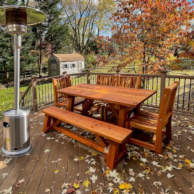 The Classic Redwood Patio Table (Options: 6' L x 34 1/2" W, California Redwood, Benches & Ruth Armless Chairs, 1 Full Length Bench and 4 Chairs by Custom Request, Standard Tabletop, Slightly Rounded Corners, No Umbrella Hole, Transparent Premium Sealant). Photo Courtesy of C. Borrell of Rockville, Maryland.