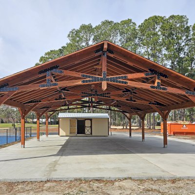 The Esther Scissor Truss Pavilion (Options: 45’ L x 35’ W, California Redwood, Standard 3/4" T&G Roof Boards, 10' H Posts, with 3 Ceiling Fan Bases, 8 High-Wind Post Anchors, Transparent Premium Sealant). Photo Courtesy of F. Parini of Myrtle Beach, South Carolina.
