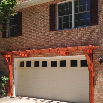 Custom Garage Arbor Kits (Options: 20' x 24", Mature Redwood, 9 ft Posts, Post Anchor Kit for High-Wind, Transparent Premium Sealant). Photo Courtesy of Josef Messmer of Fayetteville, Pennsylvania.