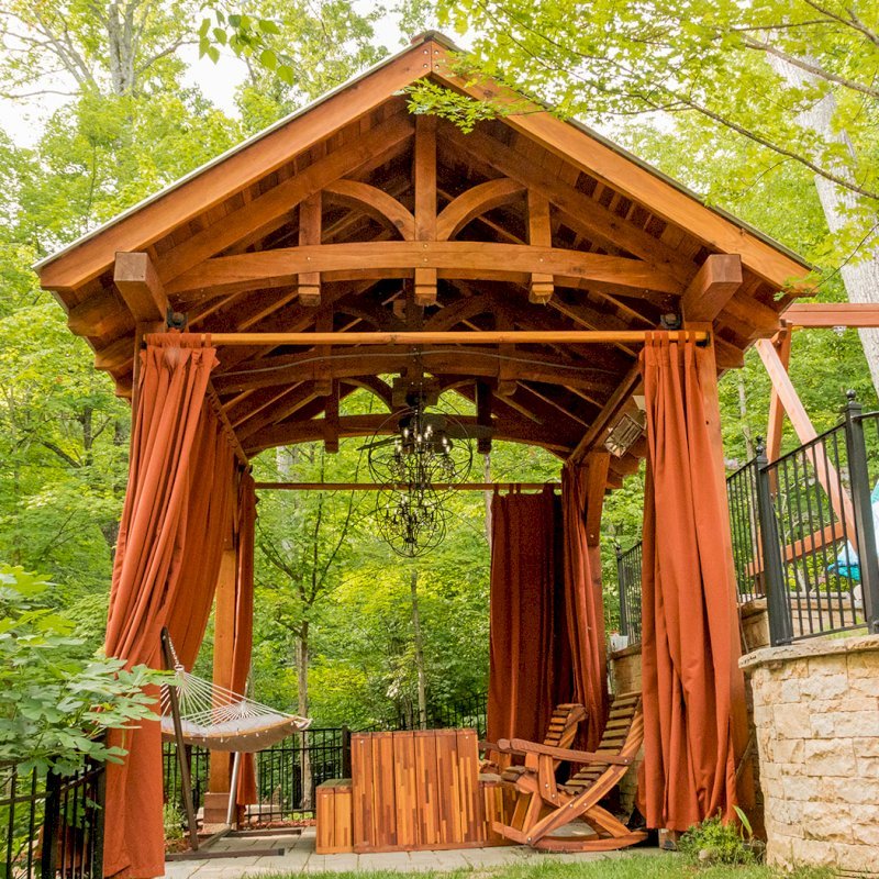 The Granada Pavilion (Options: 18' L x 15' W, California Redwood with a 15-year warranty, 4-post Anchor Kit for Gale-Wind, Electrical Wiring Trim for 1 Post, 3 Ceiling Fan Bases, 4 Curtain Rods, Transparent Premium Sealant). Photo Courtesy of J. Rynerson of Franklin, Tennessee. The Granada Pavilion (Options: 18' L x 15' W, California Redwood with a 15-year warranty, 4-post Anchor Kit for Gale-Wind, Electrical Wiring Trim for 1 Post, 3 Ceiling Fan Bases, 4 Curtain Rods, Transparent Premium Sealant). Photo Courtesy of J. Rynerson of Franklin, Tennessee.
