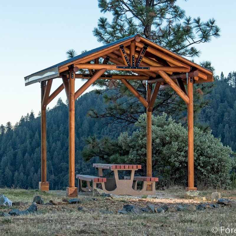 The Humboldt Log Pavilion (Options: 6in x 6in Posts thickness, 12ft L x 12ft W, No Privacy Panels, California Redwood, 2 Fascia Boards for Gutters, 9.5ft Post Height, No Electrical Wiring Trim for 2 Posts, 4-Post Anchor Kit for Gale-Wind, No Ceiling Fan Fan Bases, No Curtain Rods, Transparent Premium Sealant). CUSTOM REQUEST: Metal Roof. The Humboldt Log Pavilion (Options: 6in x 6in Posts thickness, 12ft L x 12ft W, No Privacy Panels, California Redwood, 2 Fascia Boards for Gutters, 9.5ft Post Height, No Electrical Wiring Trim for 2 Posts, 4-Post Anchor Kit for Gale-Wind, No Ceiling Fan Fan Bases, No Curtain Rods, Transparent Premium Sealant). CUSTOM REQUEST: Metal Roof.