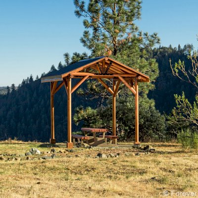 Humboldt Log Pavilion (Options: 6in x 6in Posts Thickness, 12ft L x 12ft W, No Privacy Panels, California Redwood, 2 Fascia Boards for Gutters, 9.5ft Post Height, No Electrical Wiring Trim, 4-Post Anchor Kit for High-Wind, No Ceiling Fan Fan Bases, No Curtain Rods, Transparent Premium Sealant). Metal Roof Installed by Custom Request.