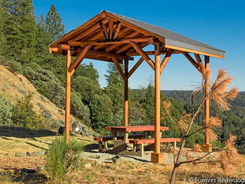The Humboldt Log Pavilion (Options: 6in x 6in Posts thickness, 12ft L x 12ft W, No Privacy Panels, California Redwood, 2 Fascia Boards for Gutters, 9.5ft Post Height, No Electrical Wiring Trim for 2 Posts, 4-Post Anchor Kit for Gale-Wind, No Ceiling Fan Fan Bases, No Curtain Rods, Transparent Premium Sealant). CUSTOM REQUEST: Metal Roof. The Humboldt Log Pavilion (Options: 6in x 6in Posts thickness, 12ft L x 12ft W, No Privacy Panels, California Redwood, 2 Fascia Boards for Gutters, 9.5ft Post Height, No Electrical Wiring Trim for 2 Posts, 4-Post Anchor Kit for Gale-Wind, No Ceiling Fan Fan Bases, No Curtain Rods, Transparent Premium Sealant). CUSTOM REQUEST: Metal Roof.