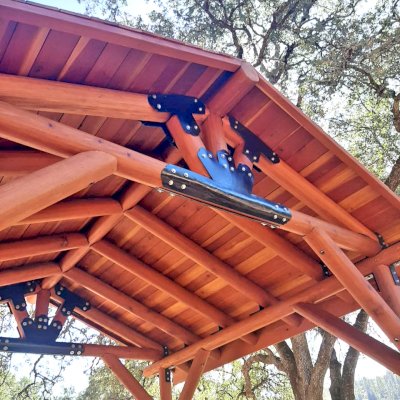 Humboldt Log Pavilion (Options: 6in x 6in Posts Thickness, 12ft L x 12ft W, No Privacy Panels, California Redwood, 2 Fascia Boards for Gutters, 9.5ft Post Height, No Electrical Wiring Trim, 4-Post Anchor Kit for High-Wind, No Ceiling Fan Fan Bases, No Curtain Rods, Transparent Premium Sealant). Metal Roof Installed by Custom Request.