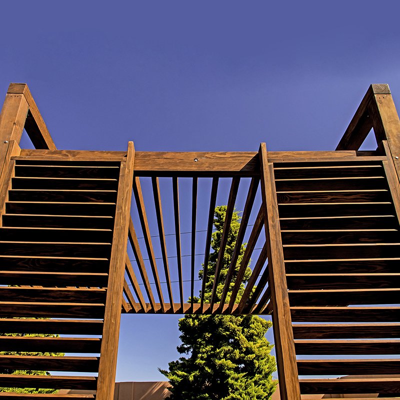 The L.A. Modern Pergola (options: 16' L, 14' W, Douglas-fir, No Rain Guard, 10 ft Post Height, No Electrical Wiring Trim, 4 Post Anchor Kit for Gale-Wind, No Ceiling Fan Base, No Retractable Shade Canopy, Cherry Stain Premium Sealant). The L.A. Modern Pergola (options: 16' L, 14' W, Douglas-fir, No Rain Guard, 10 ft Post Height, No Electrical Wiring Trim, 4 Post Anchor Kit for Gale-Wind, No Ceiling Fan Base, No Retractable Shade Canopy, Cherry Stain Premium Sealant).