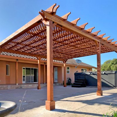 The Lattice Pergola Kit (Options: 24' L x 20' W, California Redwood, No Electrical Wiring Trim, Lattice Roof, Lengthwise Roof Support Timbers, 6-Post Anchor Kit for Concrete, No ceiling Fan Base, No Privacy Panels, No Curtains Rods, 9.5' Post Height, Transparent Premium Sealant). Photo Courtesy of C. Lopez of Salinas, CA.
