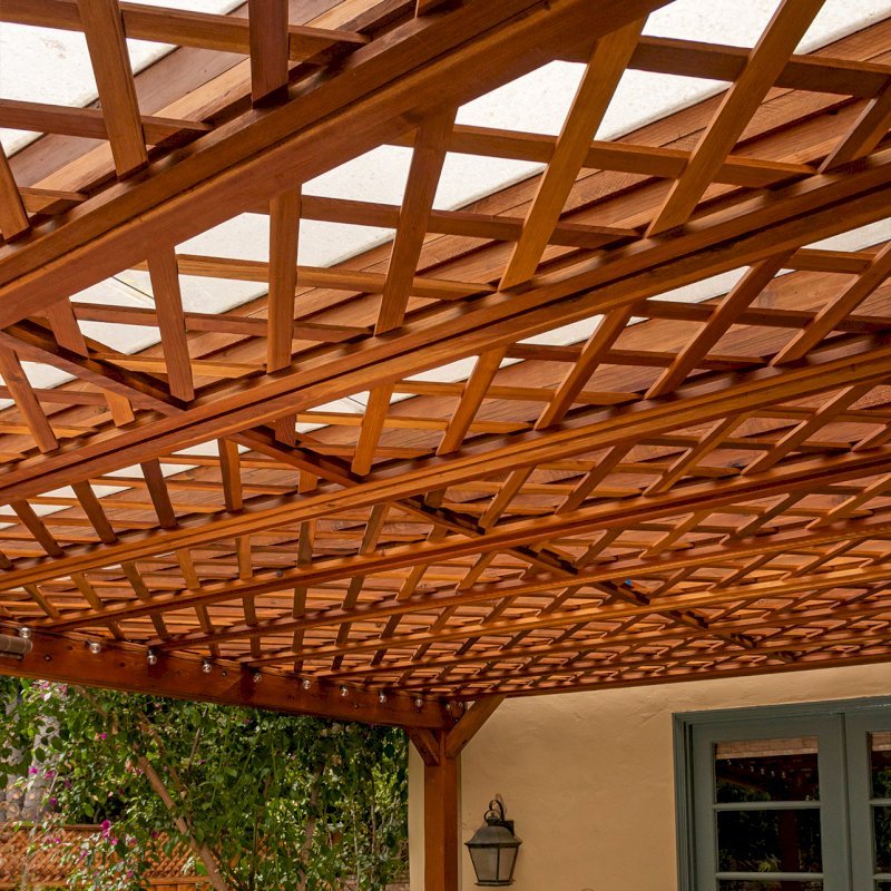 Custom The Lattice Pergola Kit (Options: 19' L x 16' W, California Redwood, Electrical Wiring Trim for 2 Posts, Lattice Roof, 4-Post Kit for Concrete, No Ceiling Fan Base, No Privacy Panels, No Curtain Rods, 9' Post Height, Transparent Premium Sealant). Lattice panels were customized with larger openings than is the standard design. Photo Courtesy of D. Wood of Palo Alto, California. Custom The Lattice Pergola Kit (Options: 19' L x 16' W, California Redwood, Electrical Wiring Trim for 2 Posts, Lattice Roof, 4-Post Kit for Concrete, No Ceiling Fan Base, No Privacy Panels, No Curtain Rods, 9' Post Height, Transparent Premium Sealant). Lattice panels were customized with larger openings than is the standard design. Photo Courtesy of D. Wood of Palo Alto, California.