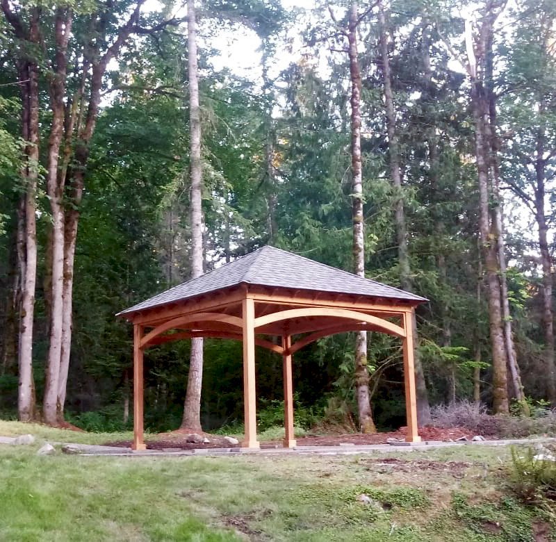 The Loreto Pavilion (Options: 15' L x 15' W, No Privacy Panels, Douglas-fir, 9.5' H, No Electrical Wiring Trim, 4-Post Anchor Kit for Concrete, No Post Decorative Trim, No Ceiling Fan Base, No Curtain Rods, Transparent Premium Sealant.). Photo Courtesy of A. Barr of Fall City, WA. The Loreto Pavilion (Options: 15' L x 15' W, No Privacy Panels, Douglas-fir, 9.5' H, No Electrical Wiring Trim, 4-Post Anchor Kit for Concrete, No Post Decorative Trim, No Ceiling Fan Base, No Curtain Rods, Transparent Premium Sealant.). Photo Courtesy of A. Barr of Fall City, WA.
