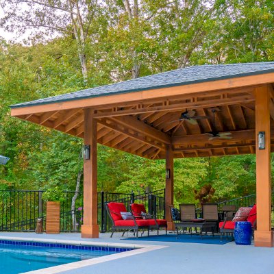 Custom Loreto Pavilion (Options: 26ft x 22ft, Mature Redwood, 11' H Posts, 10 x 10 Posts, 4 Electrical Wiring Trims, 4 Post High-Wind Anchor Kit, 2 Ceiling Fan Bases, No Curtain Rods, Transparent Premium Sealant, with Custom Detail Between Posts). Photo Courtesy of P. Gmerek of Wildwood, Missouri.
