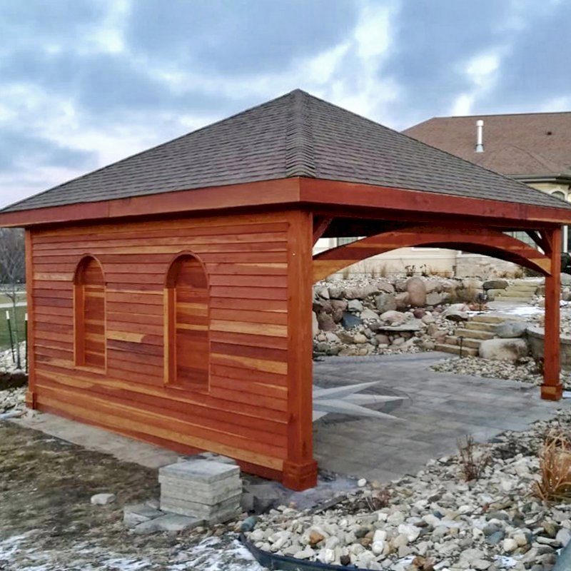 The Loreto Pavilion (Options: 20' L x 20' W, No Privacy Panels, California Redwood, 10' H, Electrical Wiring Trim for 1 Post, 4-Post Anchor Kit for Gale-Wind, No Post Decorative Trim, 1 Ceiling Fan Base, No Curtain Rods, Transparent Premium Sealant, Custom Wall with Shutters). Photo Courtesy of A. Schurman of Cedar Falls, Iowa. The Loreto Pavilion (Options: 20' L x 20' W, No Privacy Panels, California Redwood, 10' H, Electrical Wiring Trim for 1 Post, 4-Post Anchor Kit for Gale-Wind, No Post Decorative Trim, 1 Ceiling Fan Base, No Curtain Rods, Transparent Premium Sealant, Custom Wall with Shutters). Photo Courtesy of A. Schurman of Cedar Falls, Iowa.