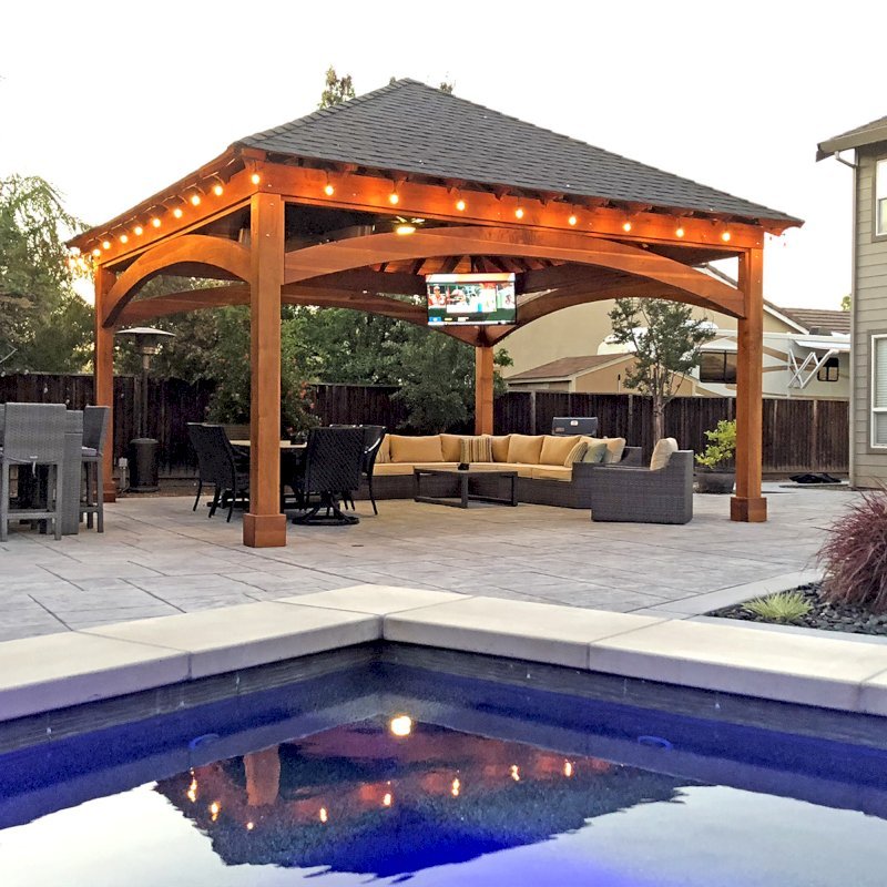 The Loreto Pavilion (Options: 20ft L x 20ft W, No Privacy Panels, California Redwood, 10ft H, Electrical Wiring for 2 Posts, 4-Post Anchor Kit for Gale Wind, No Post Decorative Trim, 1 Ceiling Fan Base, No Curtain Rods, Transparent Premium Sealant). Photo Courtesy of G. Arruda of Livermore, California. The Loreto Pavilion (Options: 20ft L x 20ft W, No Privacy Panels, California Redwood, 10ft H, Electrical Wiring for 2 Posts, 4-Post Anchor Kit for Gale Wind, No Post Decorative Trim, 1 Ceiling Fan Base, No Curtain Rods, Transparent Premium Sealant). Photo Courtesy of G. Arruda of Livermore, California.