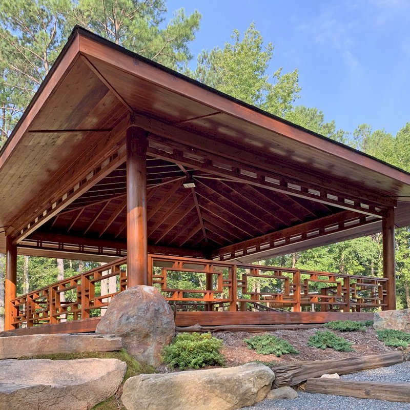 Custom The Loreto Pavilion (Options: 32' x 32', Mature Redwood, Post Anchor Kit for Gale-Wind, No Electrical Wiring Trim Kit, 4ft Overhangs by Custom Request, Custom Deck and Railings, Transparent Premium Sealant). Photo J. Hill of Apex, North Carolina. Custom The Loreto Pavilion (Options: 32' x 32', Mature Redwood, Post Anchor Kit for Gale-Wind, No Electrical Wiring Trim Kit, 4ft Overhangs by Custom Request, Custom Deck and Railings, Transparent Premium Sealant). Photo J. Hill of Apex, North Carolina.