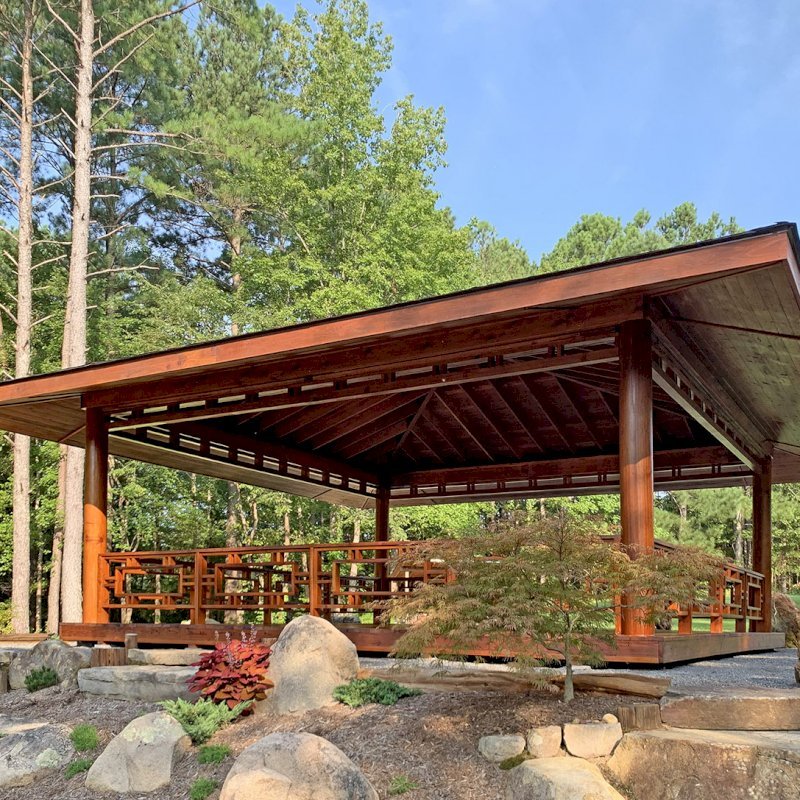 Custom The Loreto Pavilion (Options: 32' x 32', Mature Redwood, Post Anchor Kit for Gale-Wind, No Electrical Wiring Trim Kit, 4ft Overhangs by Custom Request, Custom Deck and Railings, Transparent Premium Sealant). Photo J. Hill of Apex, North Carolina. Custom The Loreto Pavilion (Options: 32' x 32', Mature Redwood, Post Anchor Kit for Gale-Wind, No Electrical Wiring Trim Kit, 4ft Overhangs by Custom Request, Custom Deck and Railings, Transparent Premium Sealant). Photo J. Hill of Apex, North Carolina.