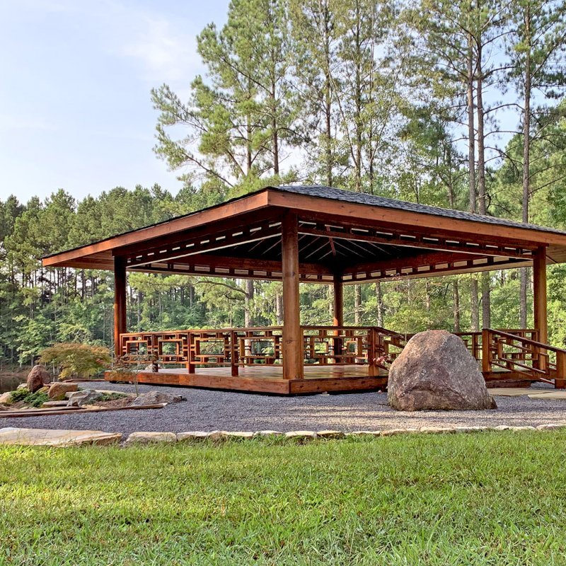 Custom The Loreto Pavilion (Options: 32' x 32', Mature Redwood, Post Anchor Kit for Gale-Wind, No Electrical Wiring Trim Kit, 4ft Overhangs by Custom Request, Custom Deck and Railings, Transparent Premium Sealant). Photo J. Hill of Apex, North Carolina. Custom The Loreto Pavilion (Options: 32' x 32', Mature Redwood, Post Anchor Kit for Gale-Wind, No Electrical Wiring Trim Kit, 4ft Overhangs by Custom Request, Custom Deck and Railings, Transparent Premium Sealant). Photo J. Hill of Apex, North Carolina.