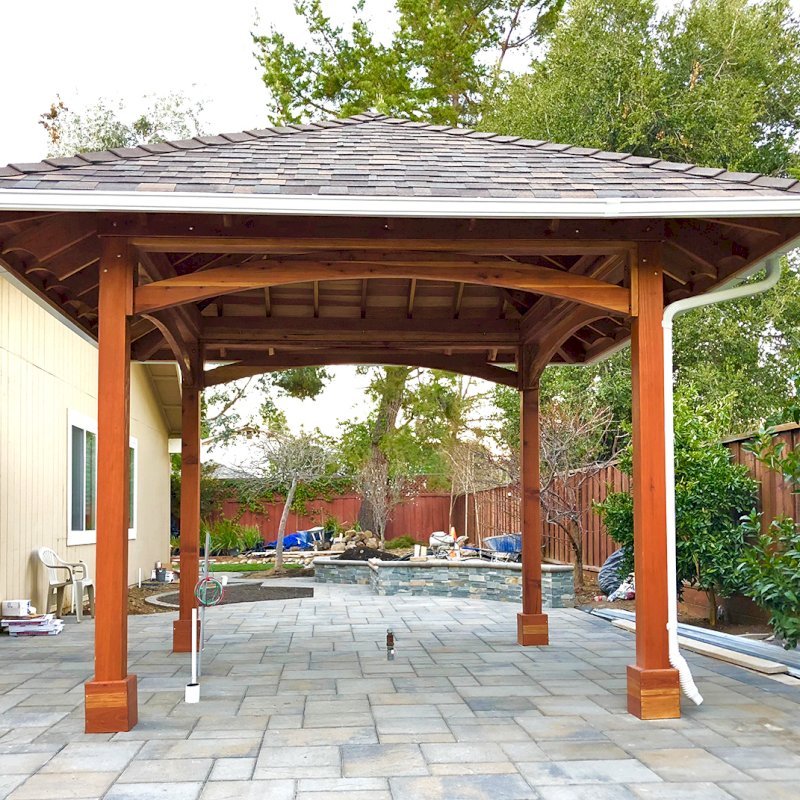 The Loreto Pavilion (Options: 14' x 14', California Redwood, Post Anchor Kit for Gale-Wind, 1 Electrical Wiring Trim Kit, 2ft Overhangs by Custom Request, Transparent Premium Sealant). Gutters added by Forever Redwood install team and can be added to any pavilion by request. Photo Courtesy of B. Hirschbeck of Los Altos, CA. The Loreto Pavilion (Options: 14' x 14', California Redwood, Post Anchor Kit for Gale-Wind, 1 Electrical Wiring Trim Kit, 2ft Overhangs by Custom Request, Transparent Premium Sealant). Gutters added by Forever Redwood install team and can be added to any pavilion by request. Photo Courtesy of B. Hirschbeck of Los Altos, CA.
