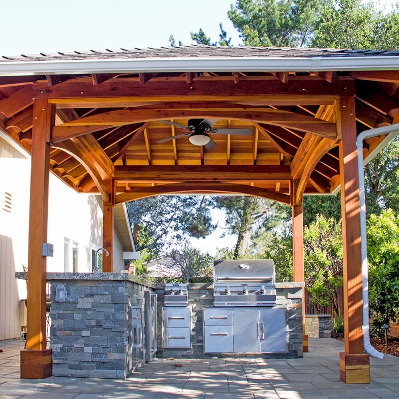 The Loreto Pavilion (Options: 14' x 14', California Redwood, Post Anchor Kit for Gale-Wind, 1 Electrical Wiring Trim Kit, 2ft Overhangs by Custom Request, Transparent Premium Sealant). Gutters added by Forever Redwood install team and can be added to any pavilion by request. Photo Courtesy of B. Hirschbeck of Los Altos, CA. The Loreto Pavilion (Options: 14' x 14', California Redwood, Post Anchor Kit for Gale-Wind, 1 Electrical Wiring Trim Kit, 2ft Overhangs by Custom Request, Transparent Premium Sealant). Gutters added by Forever Redwood install team and can be added to any pavilion by request. Photo Courtesy of B. Hirschbeck of Los Altos, CA.